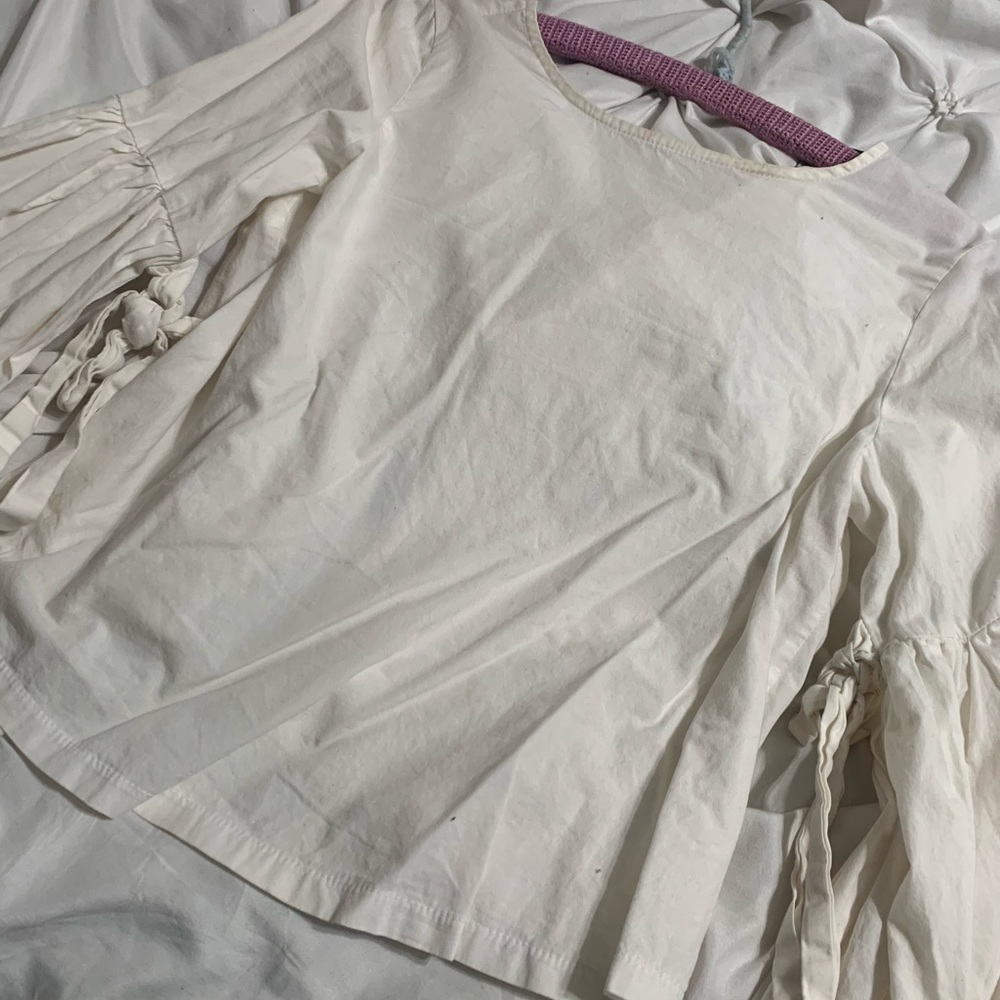 Off white open back and bell sleeve blouse